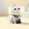 Detailed view of 3D Samoyed dog keychain with fluffy texture and gold metal clasp - Husky