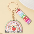 Llavero de arcoíris para profesores con texto Best Teacher y dijes de live love teach - Manzana Roja