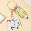 Rainbow pencil and school supplies charm keychain with gold metal finish for teachers - Glasses and Books Style