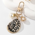 Elegant leopard print shell keychain with white pearl and gold metal lobster clasp - White Leopard