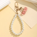 Sweet pearl bead keychain with pink acrylic cherry pendant and golden metal lobster clasp - Pink