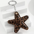 Close-up of leopard print star keychain showing high-quality leather and metal ring - Dark Coffee