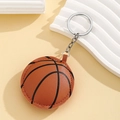 Detailed macro view of basketball keychain showing PU leather texture and premium stitching - Basketball