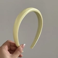 Detail showing the creamy yellow thick padded headband with a sleek satin finish texture - Glossy Yellow (6# 2CM)