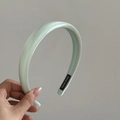 Detail of mint green satin headband featuring a thick handmade design and black label - Glossy Green (7# 2CM)