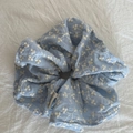 Sky blue oversized scrunchie with white floral embroidery and soft fabric texture - Large Blue Floral Scrunchie