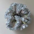 Detailed view of layered blue floral fabric hair scrunchie with light blue satin ruffled edges - Large Blue Ruffled Scrunchie