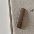Detail of a rectangular brown plaid fabric hair clip with a vintage British denim texture - Coffee Square Hair Clip