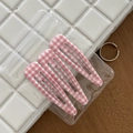 Close-up of three pink and white checkered teardrop hair clips on a textured background - 10# Pink and White Plaid