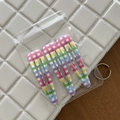 Detailed view of three rainbow checkerboard snap hair clips in clear packaging - 5# Colorful Striped White Waterdrop