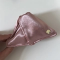 Detail view of a pink satin triangular storage bag featuring a gold engraved metal button - Triangle / Pink (1#)