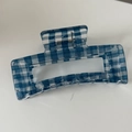 Close-up of a large rectangular blue checkered hair claw clip with acetate finish - Large Square (Blue and White Gingham)