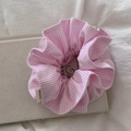 Chic pink and white striped scrunchie with Hand Made label on a textured book surface - Pink Stripe