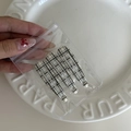 Close-up of three-piece British plaid hair clip set in transparent packaging - Coffee White Striped Style