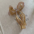 Elegant champagne pearlescent bow hair claw clip for women in a French style aesthetic - Transparent Amber
