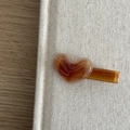 Detail of heart-shaped amber acetate hair clip with Barrette La France gold engraving - Coffee Heart Style
