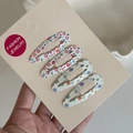 Set of four floral print metal snap hair clips for girls on a white fashion jewelry card - Colorful Floral