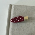 Retro cherry red duckbill hair clip with white polka dots on textured background - Water Drop Hair Clip