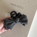 Close-up of dark grey denim bow hair claw clip with colorful sequins and black base - Bow Claw Clip / Dark Gray With Sequins