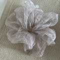 Elegant champagne seersucker scrunchie with silver rhinestones on a textured knit background - Champagne