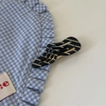 Detail of wavy black and yellow striped hair clip with a gold metal duckbill base - Black and White Stripe Wave Hair Clip