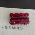 Detailed view of dark red wavy hair claw clip with white polka dots and glossy finish - Wavy Square Style