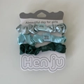 Three-piece set of satin hair scrunchies in light green, teal, and dark green on card - 8# Gradient Green