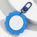 Blue sunflower keychain with a compact mirror featuring a translucent petal design - Blue