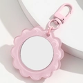 Close-up of pink flower-shaped portable mirror keychain with metallic d-ring hook - Pink