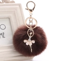 Detailed macro view of dark brown faux fur pom pom with golden rhinestone ballerina charm - 8cm Faux Rex Rabbit Fur / Dark Coffee