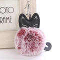 Detail of cute black faux leather cat head with burgundy and white plush pom-pom keychain - Two-tone Wine Red