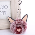 Detailed macro of a fluffy red and white cat keychain with pink heart and leather ears - Frost Wine Red