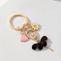 Portachiavi ballerina scintillante con strass e margherita per borse e chiavi auto - Nero