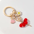 Portachiavi ballerina con strass e vestito rosso con ciondolo a margherita in smalto - Rosso