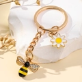 Portachiavi ape e margherita in metallo dorato con strass su base di marmo bianco - Stile 2