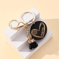 Porte-clés doré MAMA avec disque en bois cœur léopard et pompon noir élégant - Noir