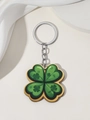 Detail of green four-leaf clover acrylic keychain with silver chain on satin - Green Shamrock Style With Yellow Border (8)