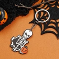 Halloween sleutelhanger met skelet en pompoen op een levendige oranje achtergrond - Schedel