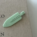 Detail showing the mint green matte hair clip with sturdy metal duckbill grip base - Mint Blue