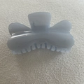 Detailed top view of a glittery blue translucent hair claw clip on white fabric - Gray Blue Butterfly (23#)
