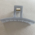 Detailed top view of a light gray jelly resin hair claw clip with a golden metal spring - Light Gray Crescent (3#)