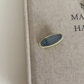 Close-up of denim fabric oval hair clip with yellow piping and blue ribbon detail - 9# Yellow Oval Clip Blue Bow