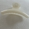Close-up of a pearlescent cream white hair claw clip with smooth crescent design - 13#
