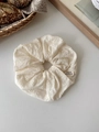 Detailed macro of cream cotton embroidery scrunchie with a black handmade woven label - White Lace Scrunchie (2#)