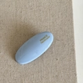 Close-up of a light blue oval hair clip with gold France Handmade lettering on fabric - Blue Oval Hair Clip