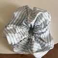 Detail of blue and white striped fabric scrunchie with unifang brand woven label - White Blue Slant Stripe Scrunchie
