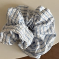 Detail view of blue and white plaid scrunchie with seersucker texture and ruffled design - Blue Slant Stripe White Scrunchie