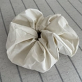 Minimalist cream oversized scrunchie hair tie on striped fabric for versatile styling - Solid Color White Scrunchie / White