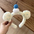 Vista dettagliata di cerchietti cartoon in peluche con finta pelliccia gialla e orecchie a pois - Ciliegia Blu