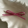 Minimalist pink PU leather bow hair clip with silver metal alligator grip in shell dish - Rose Red Bow Hair Clip